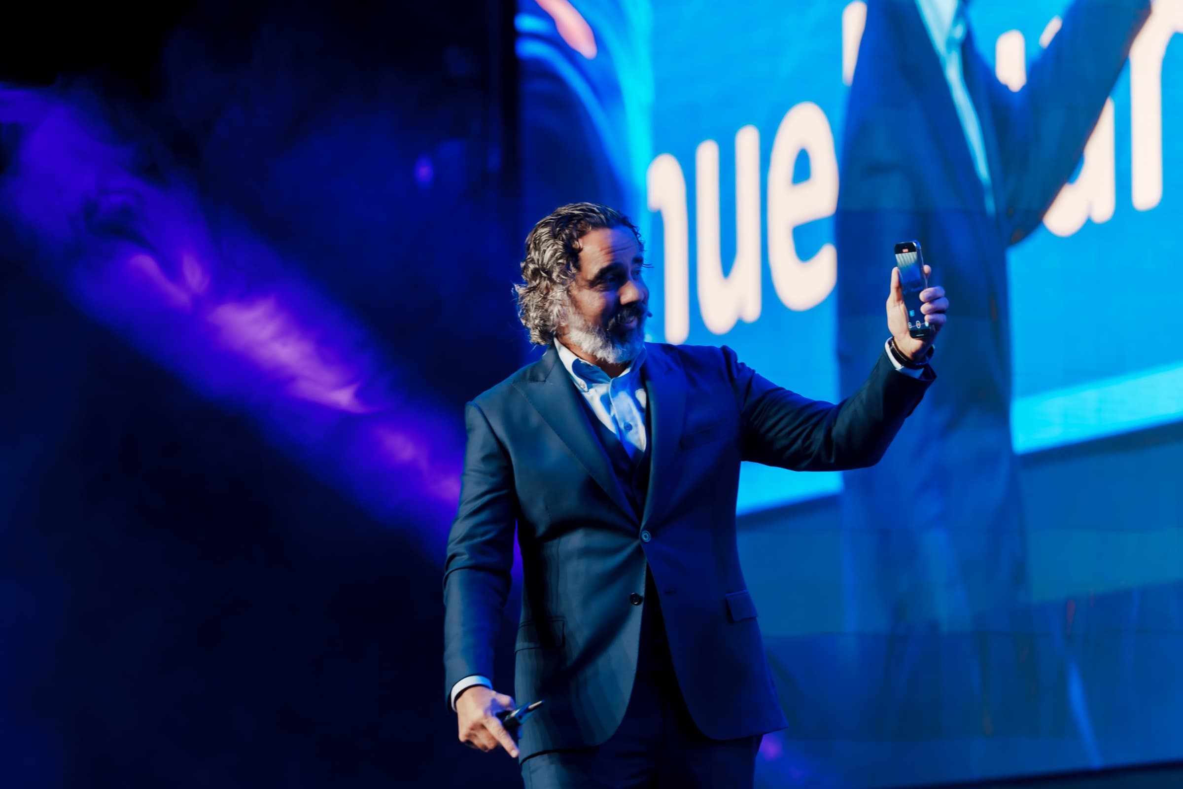 Manuel Suarez presenting against the giant LED screen at Game Changers Fest