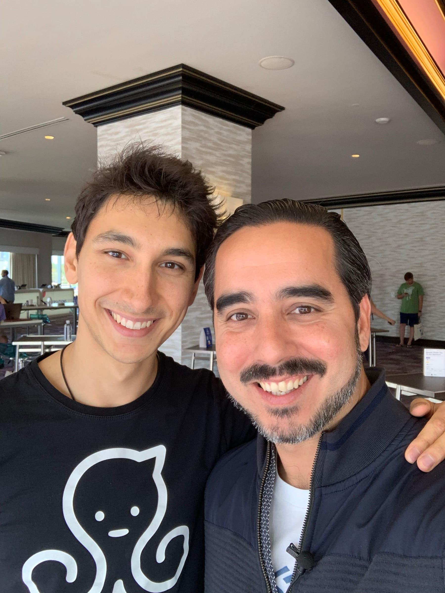 Manuel Suarez standing with ManyChat's founder