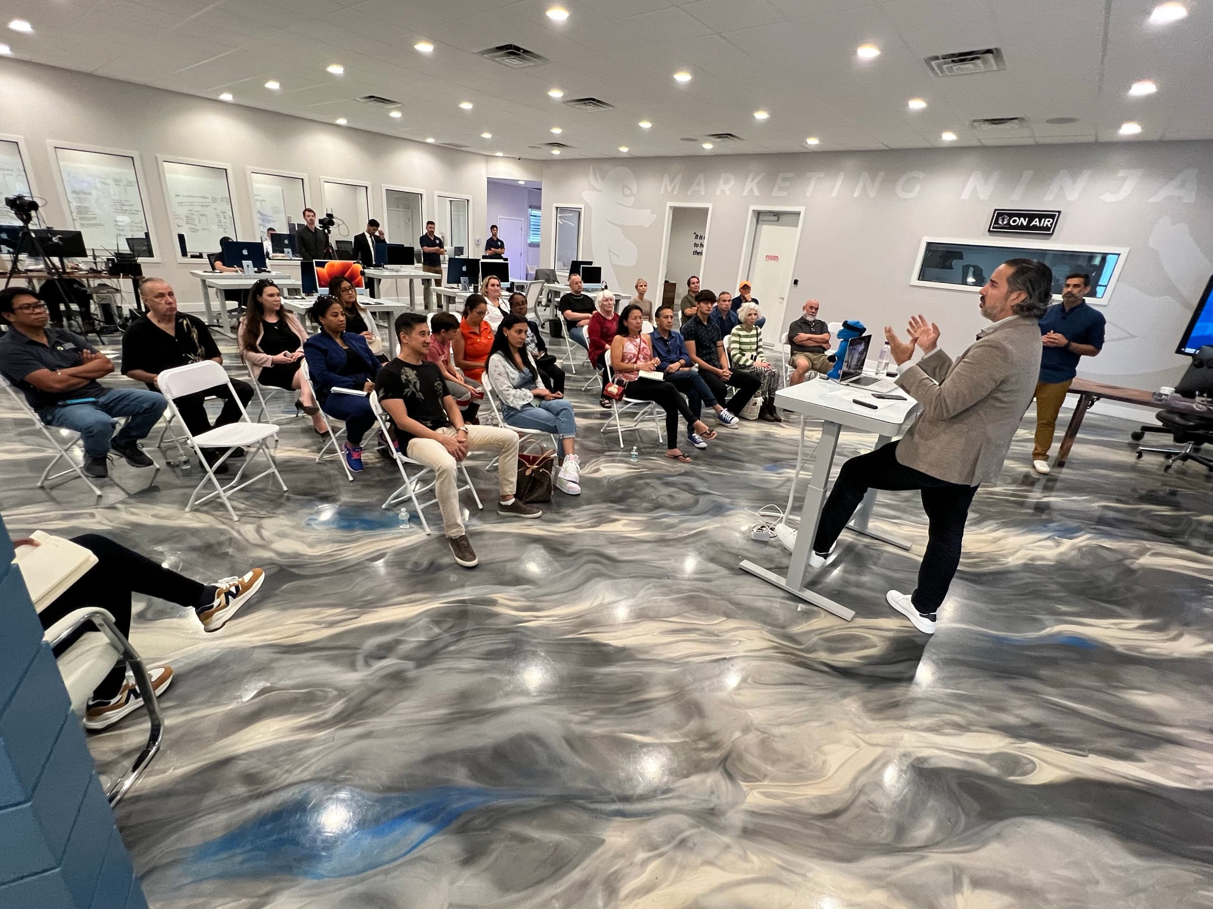 Manuel Suarez teaching animatedly in the middle of the room