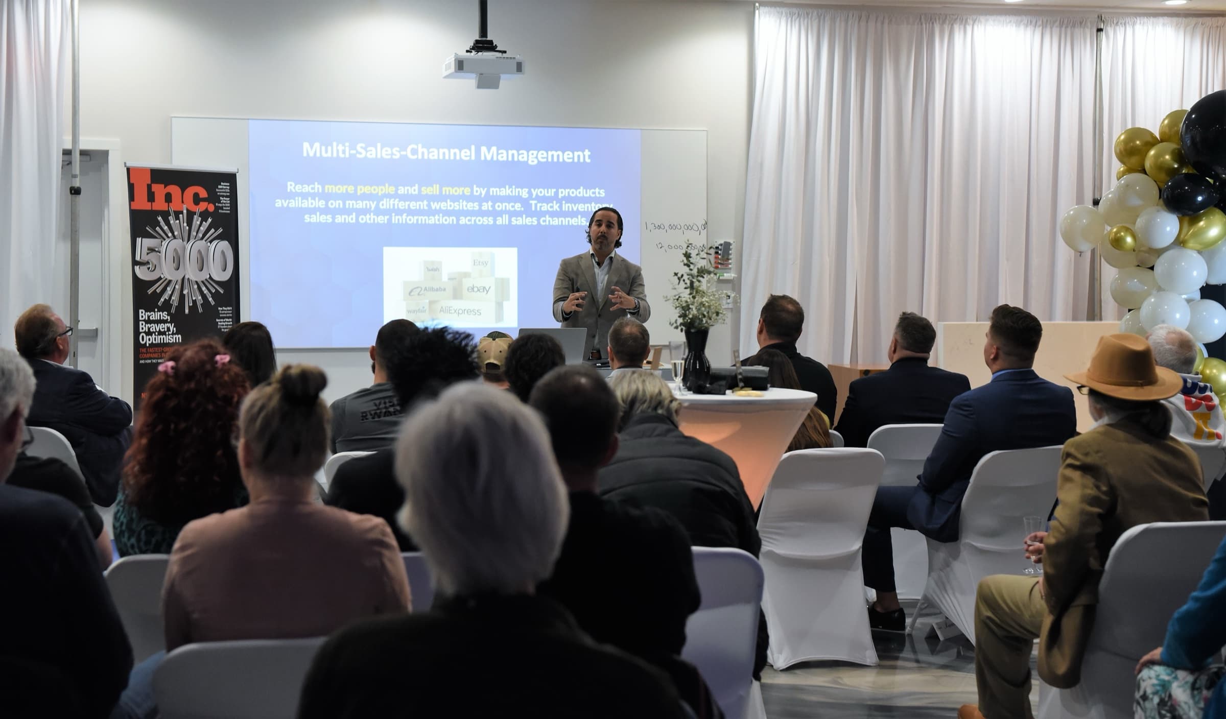 Manuel Suarez presenting to a seated crowd at an AGM workshop